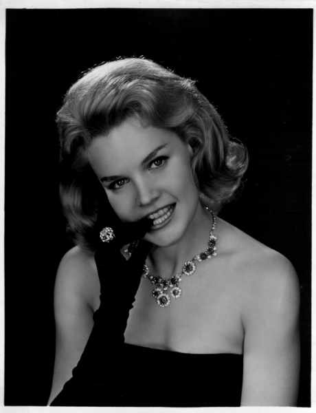 Carroll Baker in opera gloves and costume jewelry