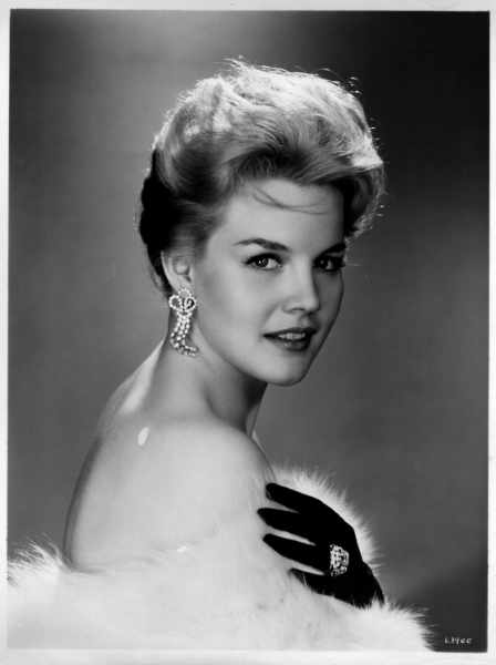 Carroll Baker with upswept hair and opera gloves